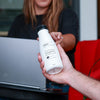 Person holding Soylent Drink Original